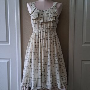 Cream Sleeveless Dress with Black Key Pattern